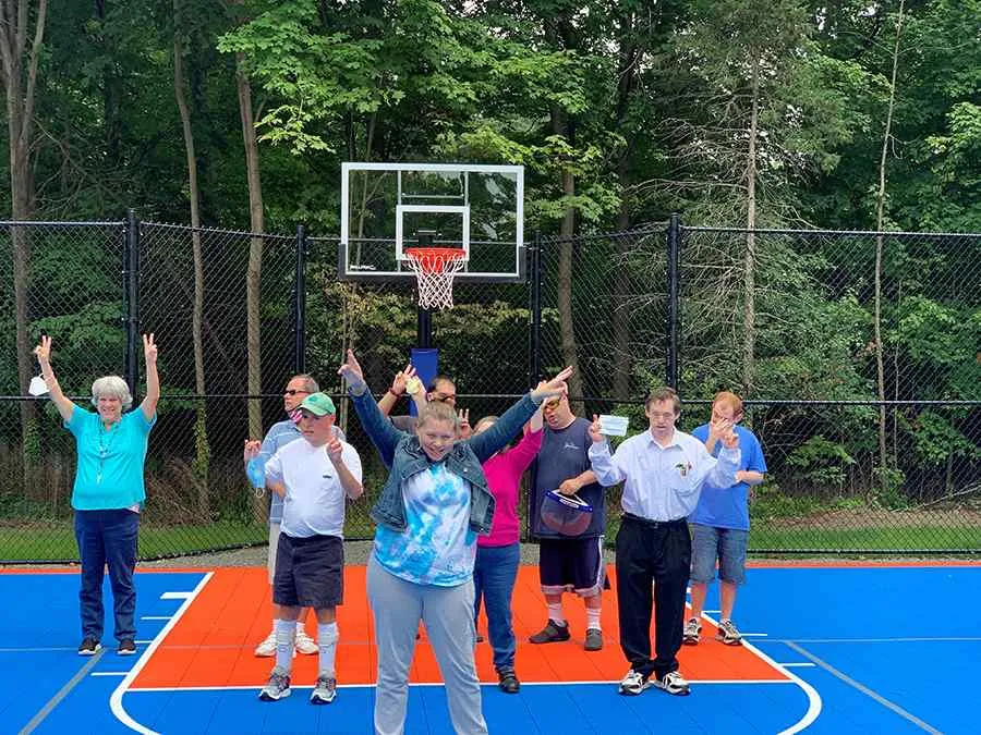 Group of clients on the new basketball court