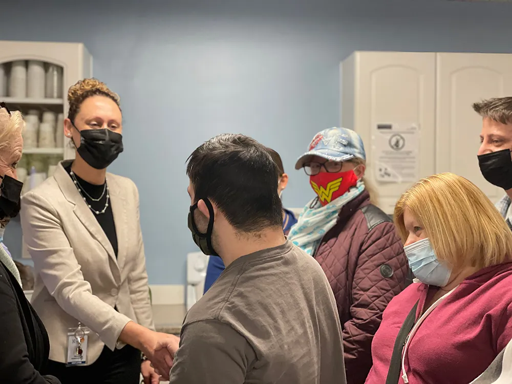 Melissa Davidson Wood shaking hands with client