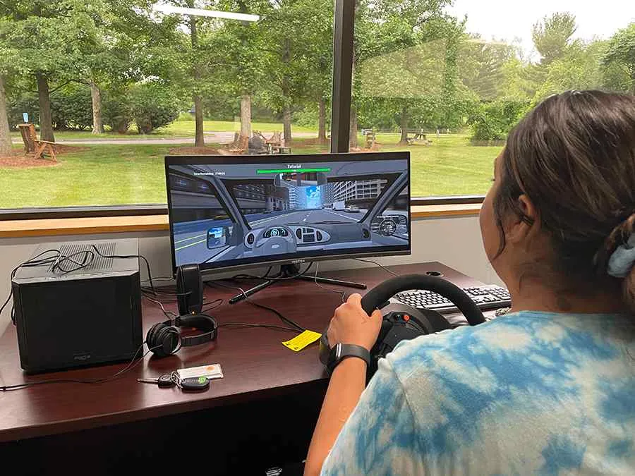 Client working on a driving simulator